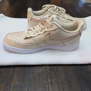 Nike Cream Sneakers with Pink Accents